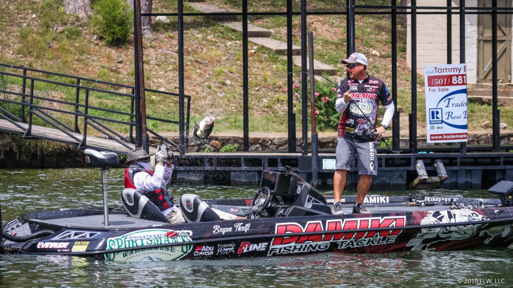 FLW-Tour-pro-Bryan-Thrift-wrangles-a20bass-into-the-boat-on-Day-Two-of-the-2019-FLW-Cup-on-Lake-Hamilton.-Jody-White