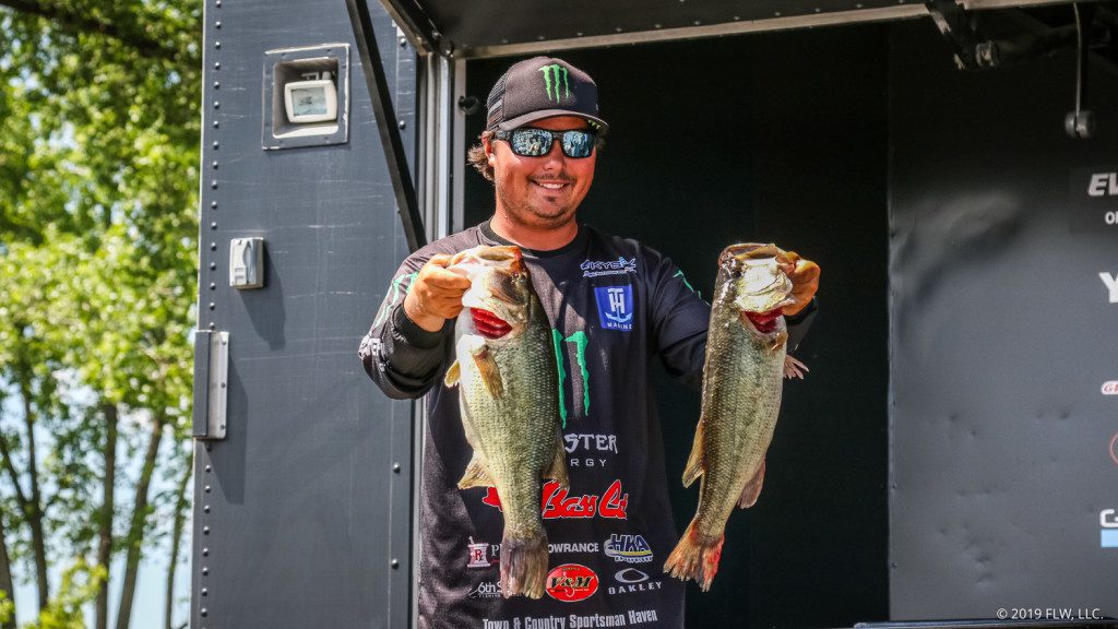 FLW-Tour-pro-Tyler-Stewart-holds-up-two-keepers-for-the-cameras-after-Day20One-of-the-FLW-Tour-on-Lake-Champlain-presented-by-T-H-Marine.-Kyle-Wood